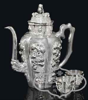 a_chinese_silver_lobed_teapot_and_a_pair_of_cups_19th_century_d5431365h.jpg